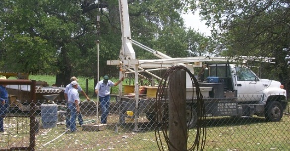 Removing the pump out of an abandoned well before plugging.