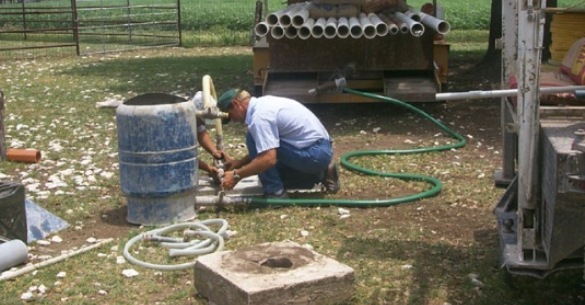Piping the mixed plugging materials into an abandoned well for efficient plugging.